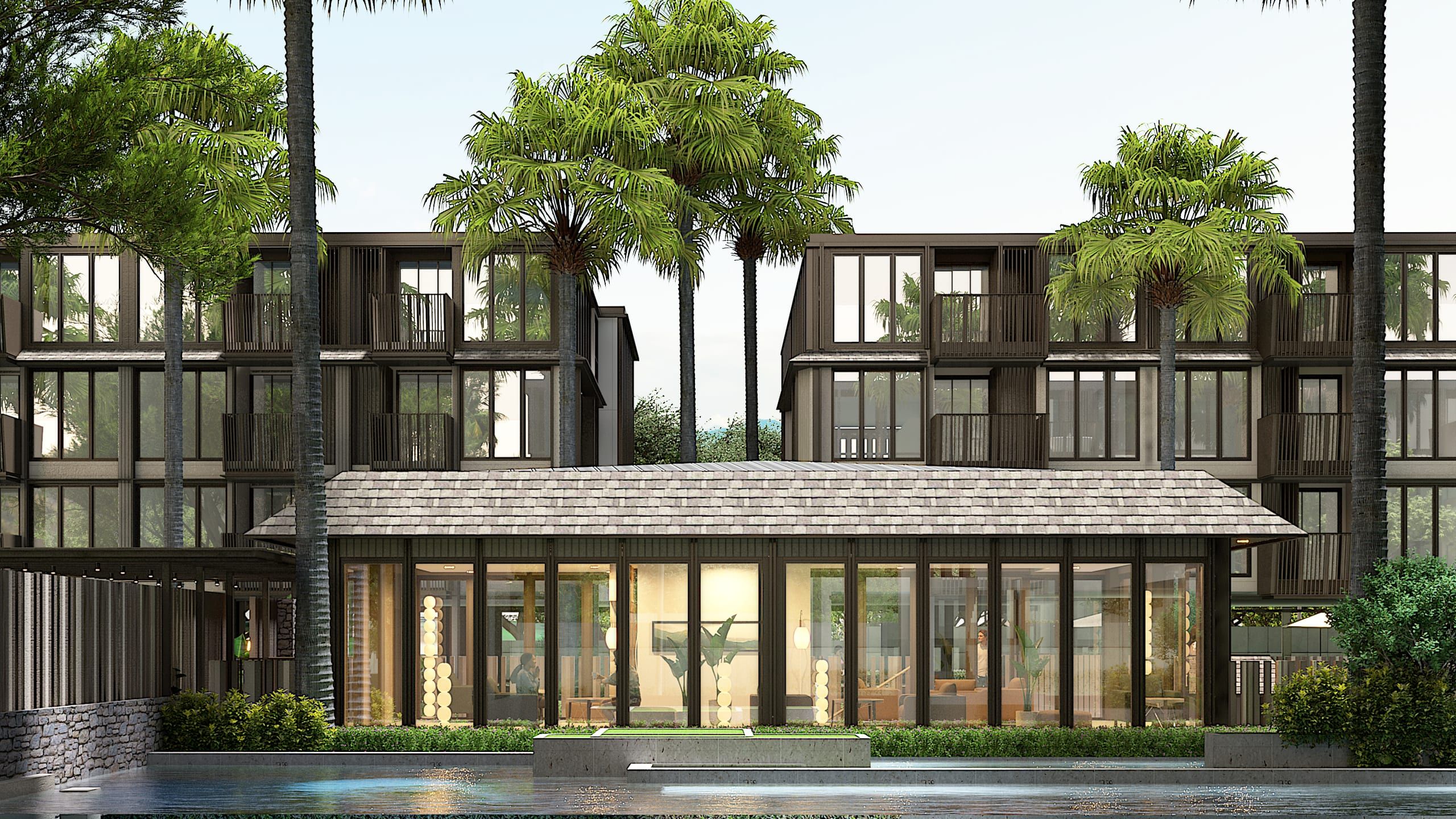Glazed clubhouse with a warmly lit lounge, seen across a pool, with two residential blocks and palms behind, visualisation