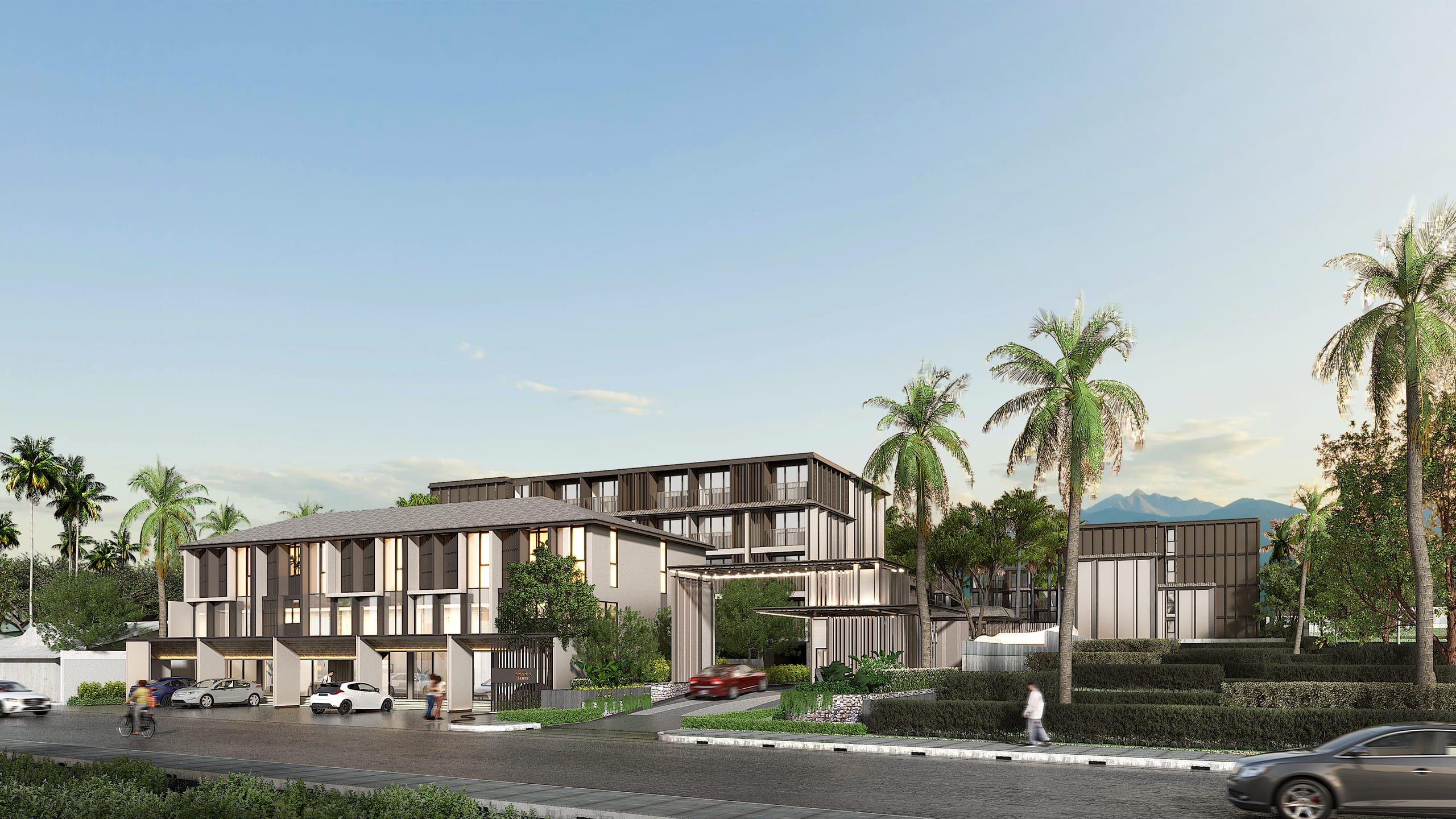 Street view of a low residential complex with a two-storey wing, taller blocks behind, palms and mountains in the distance, visualisation