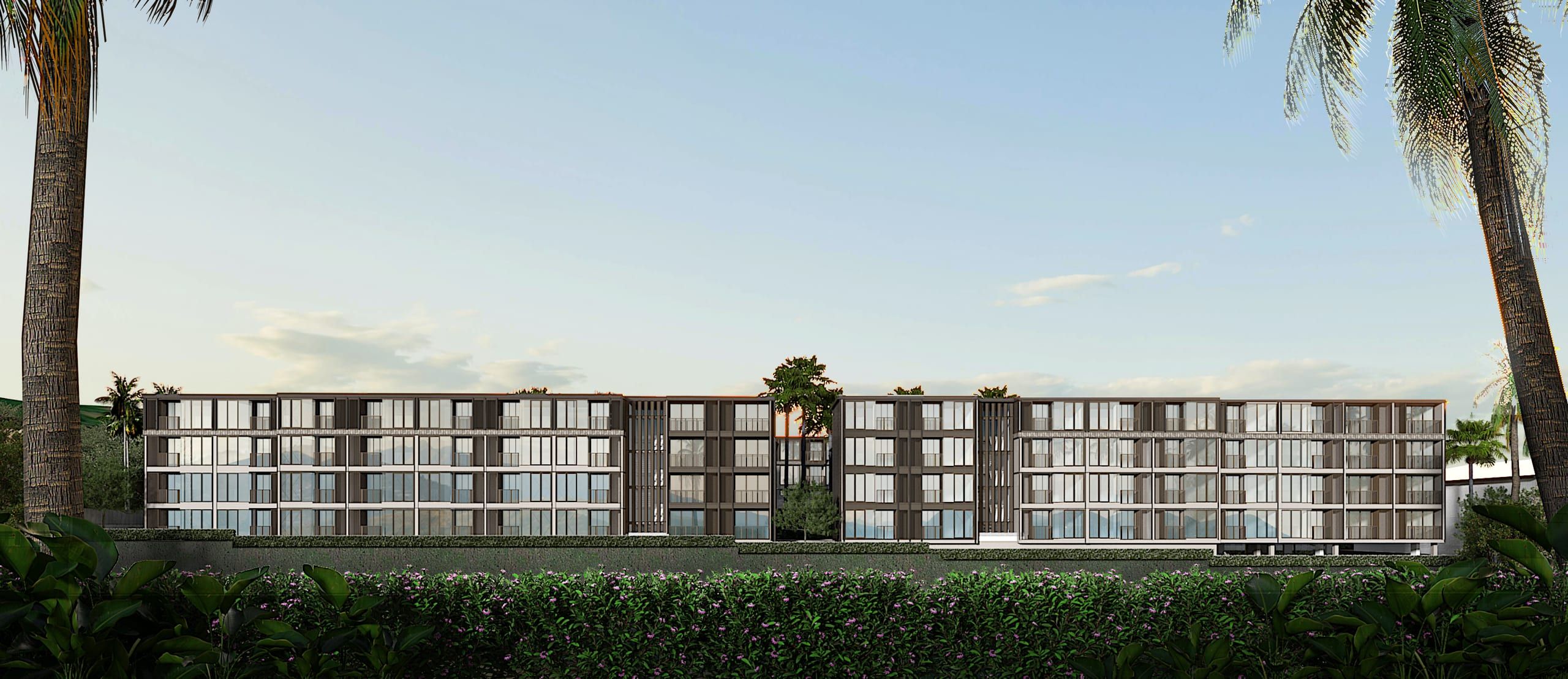 Four-storey apartment building with dark louvred facade behind a flowering hedge, framed by palm trunks, visualisation